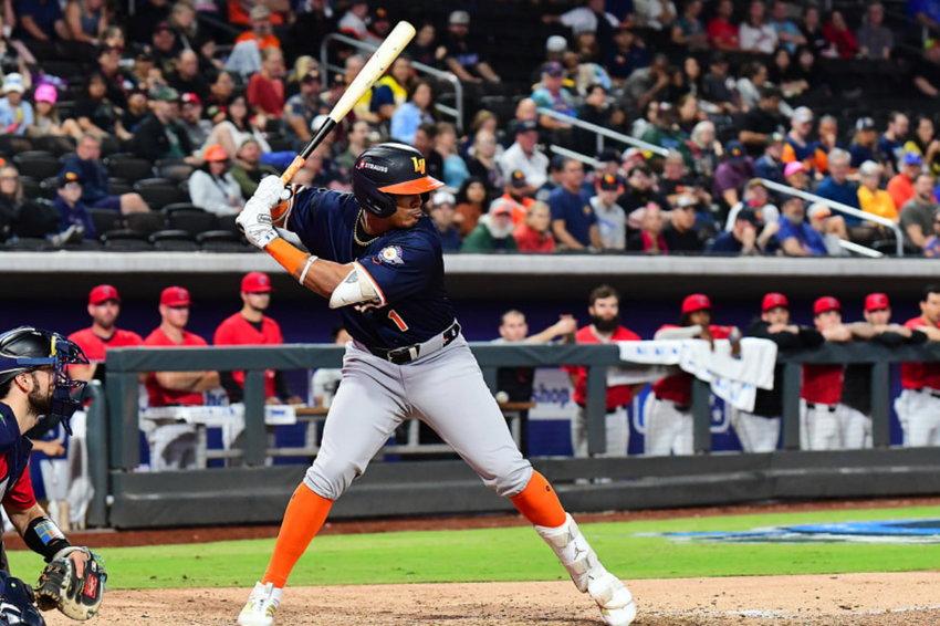 An Aviators baseball player swinging a bat