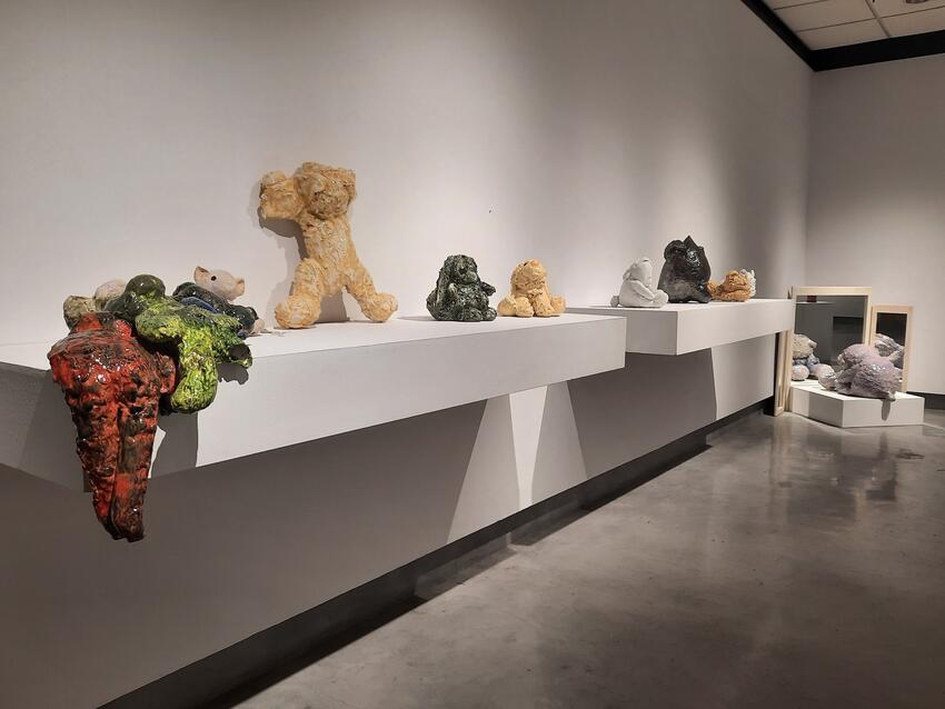 Wide view of several crystal-like art sculptures featured in the &quot;Love is a Place&quot; exhibition.