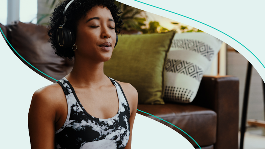 A person with headphones on and eyes closed