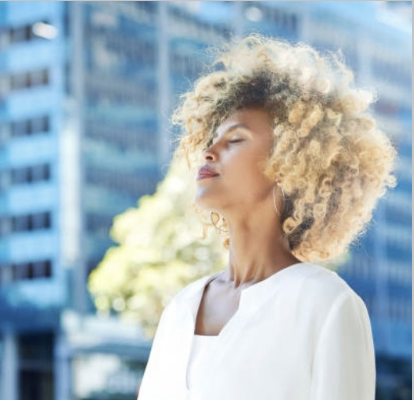 A woman practicing deep breathing