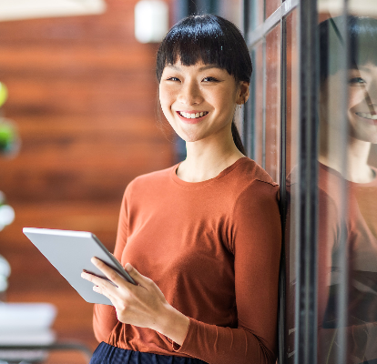 A woman holding a tablet