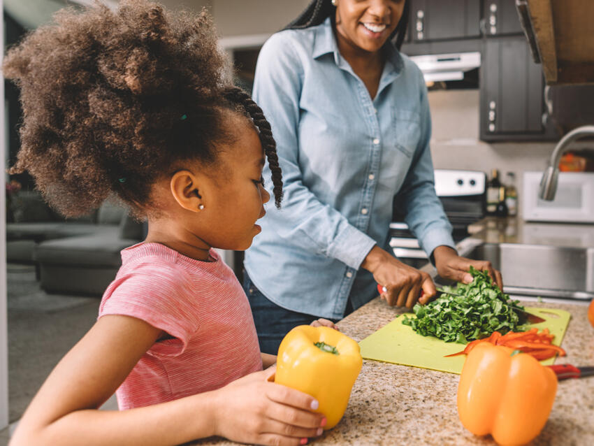 A parent and child cooking