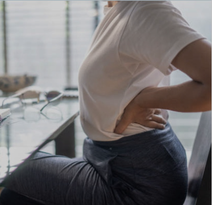 A woman stretching in a chair