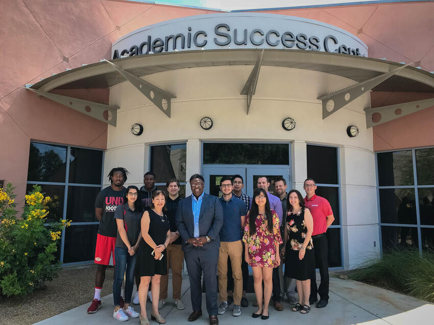 A group of students standing outside the Academic Success center