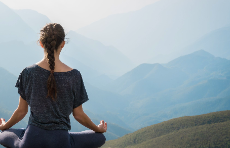 a woman practicing yoga and breathing