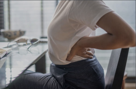 a person stretching at their desk