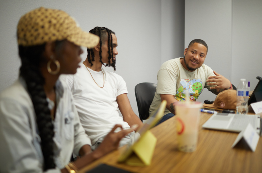 A group of three students talking