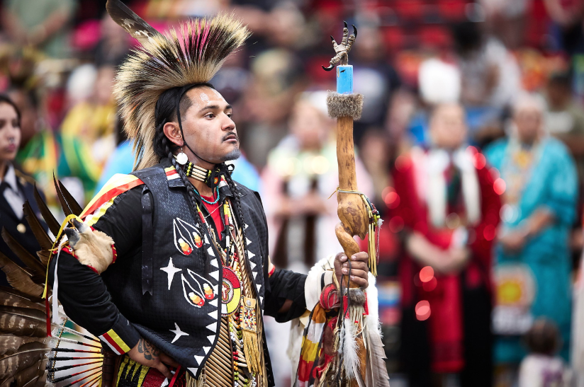 A Native American man in traditional dress