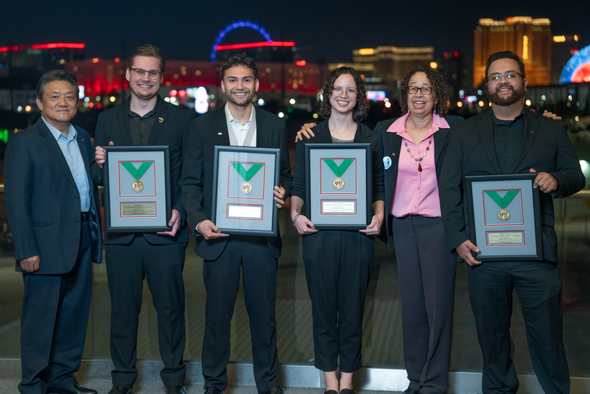 a group of students holding their awards