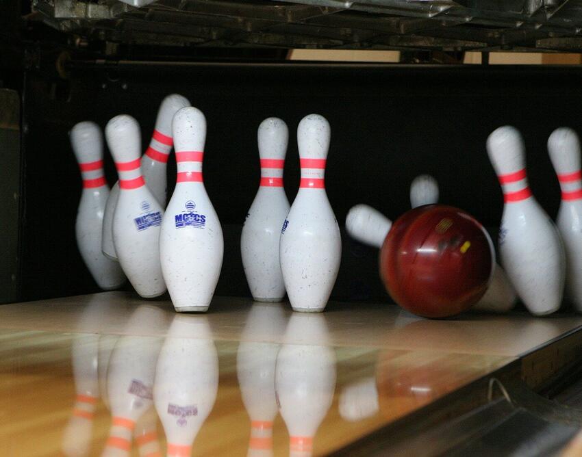 Bowling ball hitting bowling pins