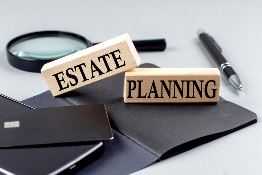 two wooden blocks spelling "estate" and "planning"