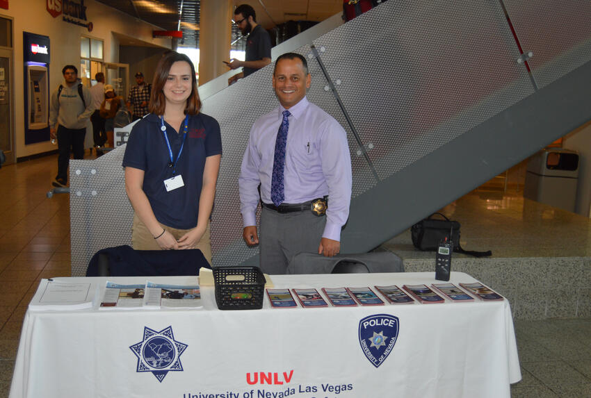 Student and UNLV Police officer at property registration table