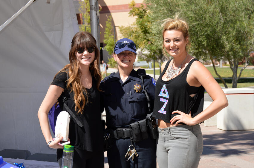 Sgt. Denise Lutey with two UNLV students