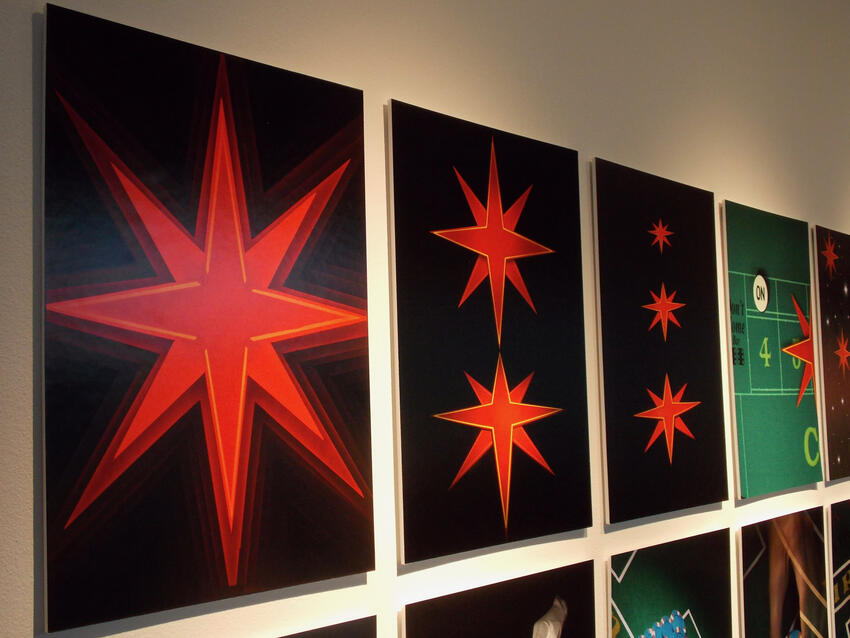 Vegas Star paintings hanging in a gallery