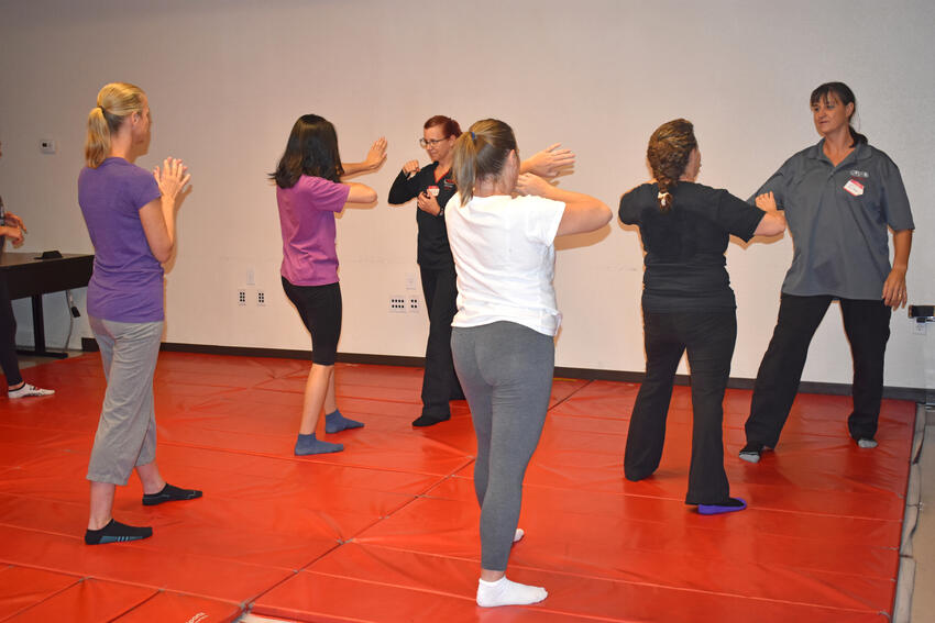 Students and instructors in a Girls on Guard class