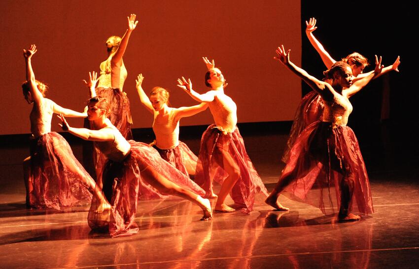 dancers perform on stage