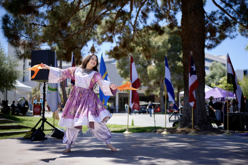Woman performing at the Festival of Communities