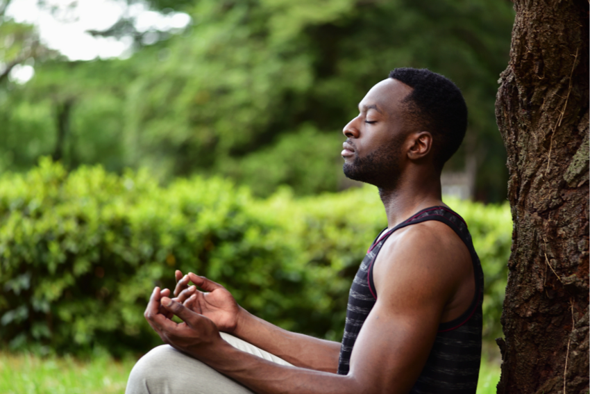 Man sitting outside and meditating