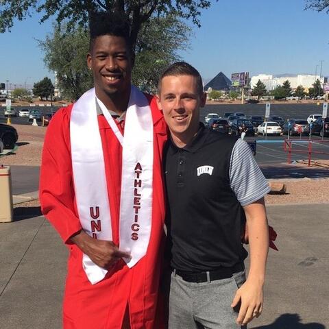 David Wedley standing with Kenny Keys at commencement.