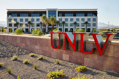 Exterior of the Harry Reid Technology Park building showing the U.N.L.V. signage leading to the building