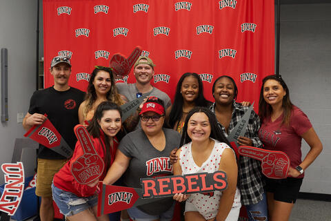 People gathering for a photobooth picture