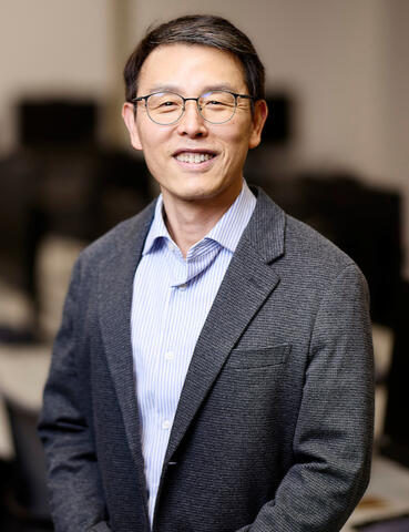 Yoohwan Kim in blazer and button up shirt