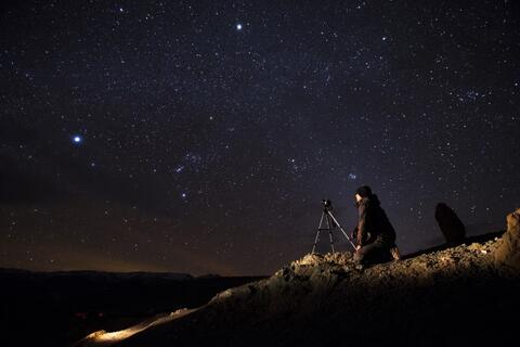 Man looking at the night sky