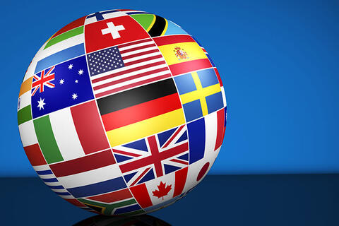 Photo of globe with flags